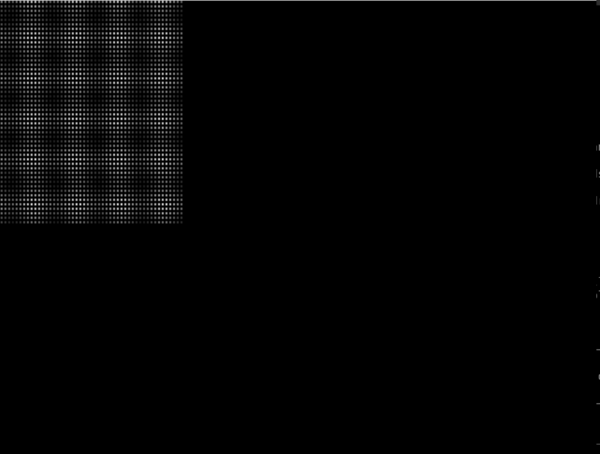 A small dithered grey pattern in the corner of an otherwise black screen